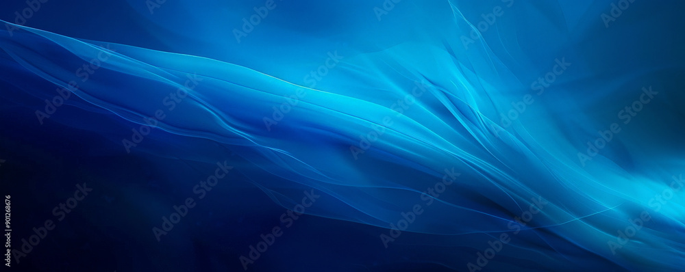 Fototapeta premium A striking blue background with a gradient that transitions from a dark blue at the top to a lighter blue at the bottom, adding a sense of movement and dynamism.