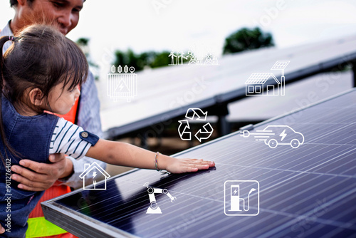 Solar cells have icons such as charging station, electric car, robot, inverter, energy saving industry. Above the solar panels, a girl's hand touches the solar farm.