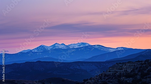 Stunning Sunset Over Majestic Mountains, Capturing the Rich Colors and Tranquil Beauty of Dusk