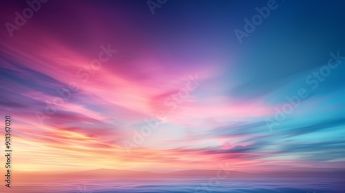 A vibrant gradient of colors blending in the sky, showcasing a stunning sunset with soft, flowing hues of pink and blue. © nattapon98