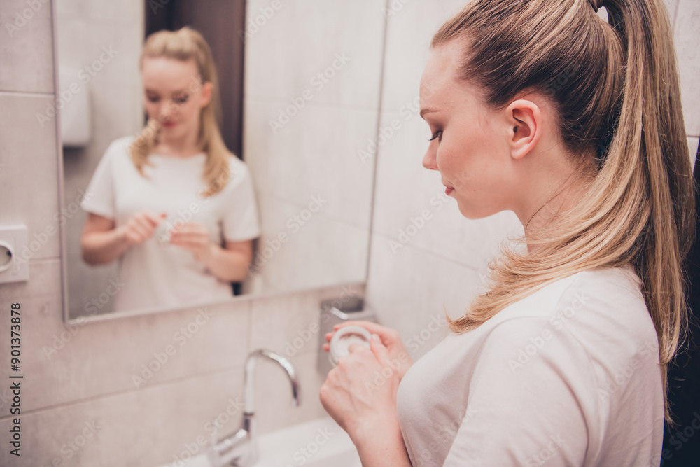 Photo of adorable sweet lady slepwear smiling enjoying skin care procedures bathroom home house Photo of adorable sweet lady slepwear smiling enjoying skin care procedures bathroom home house