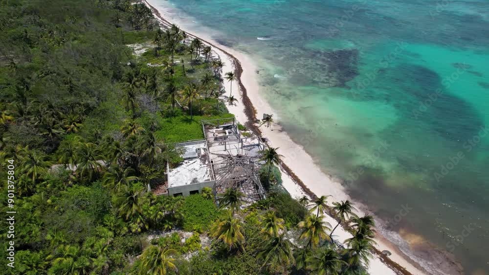 Tropical Coastline with Ruins of Building damaged by hurricane and abandoned Tropical Coastline with Ruins of Building damaged by hurricane and abandoned
