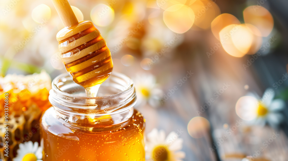A jar of honey is poured into a spoon A jar of honey is poured into a spoon