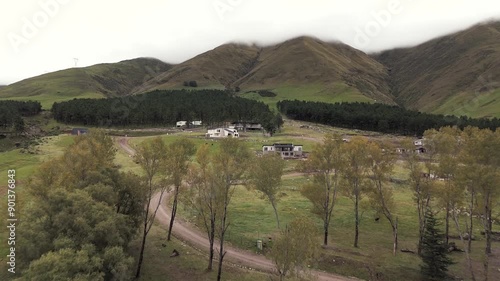 Weekend houses viewed by drones in the beautiful green, short-grass mountains of Tafí del Valle, Tucumán, Argentina. photo