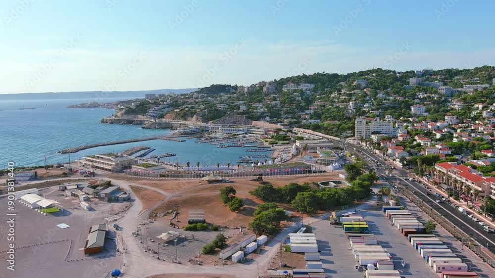 Marseille, France: Aerial view of Marina Olympique, main marina for Olympic Summer Games Paris 2024, flags of participating states flutter in wind - landscape panorama of Europe from above
Marseille, France: Aerial view of Marina Olympique, main marina for Olympic Summer Games Paris 2024, flags of participating states flutter in wind - landscape panorama of Europe from above