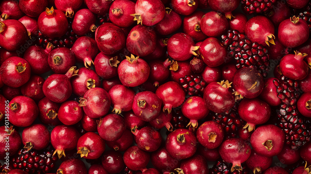 A seamless background pattern featuring pomegranate garnet fruits. A seamless background pattern featuring pomegranate garnet fruits.