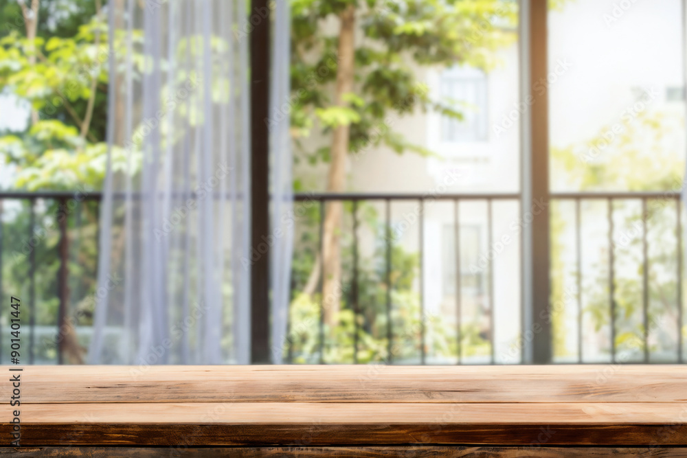 Empty wooden table with a blurred balcony view of a green garden background Empty wooden table with a blurred balcony view of a green garden background