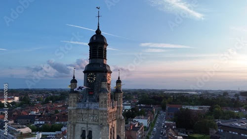 Drone shot of Sint-Michielskerk (Saint Michael Church) in Roeselare at sunset. Aerial view of the city of Roeselare, Belgium. photo