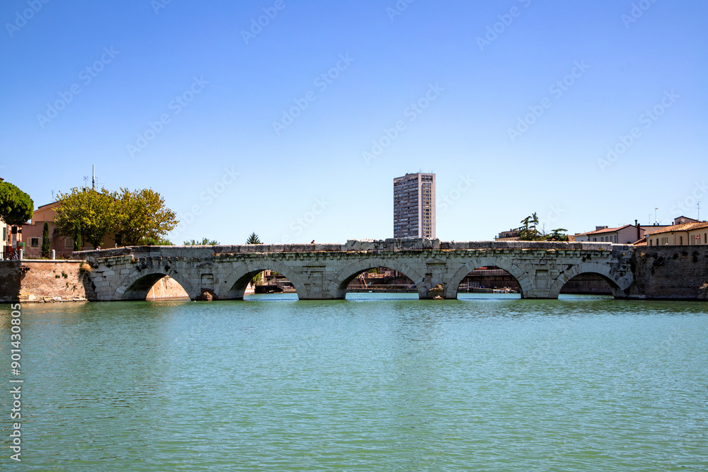 Naklejka premium Historic Tiberius Bridge, ancient Roman architecture, Rimini landmark, built 21 AD.