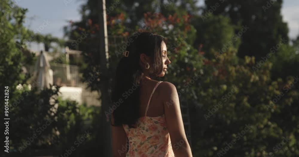 Beautiful woman walks during a sunset in slow motion Beautiful woman walks during a sunset in slow motion