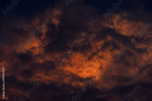 Sunset sky with orange clouds. Nature background.