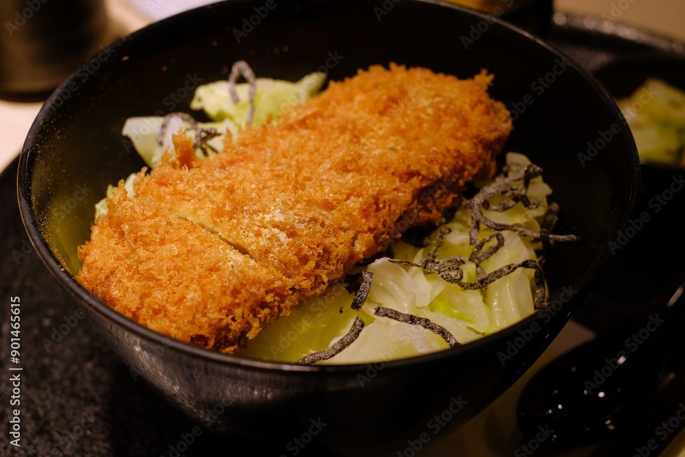 Tonkatsu are thick pork cutlets breaded with flour, egg, and bread crumbs and then deep-fried in oil. Tonkatsu are thick pork cutlets breaded with flour, egg, and bread crumbs and then deep-fried in oil.