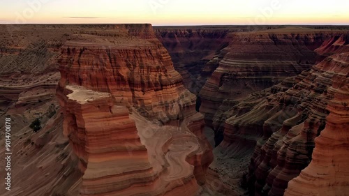 A canyon with a sunset in the background. The canyon is rocky and has a lot of trees