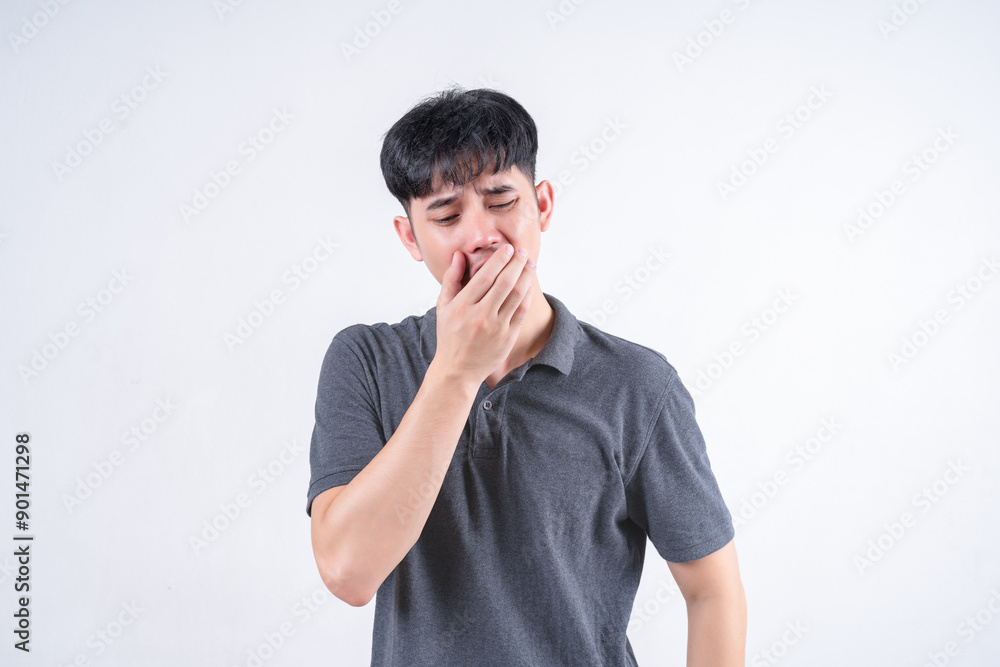 Portrait of handsome Asian man with nausea and vomiting symptoms. Medical and healthcare concept on white background. Portrait of handsome Asian man with nausea and vomiting symptoms. Medical and healthcare concept on white background.