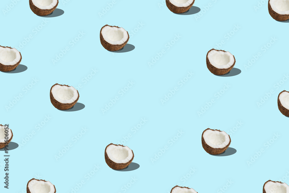Creative pattern with coconut on blue background. Minimal summer concept. Creative pattern with coconut on blue background. Minimal summer concept.
