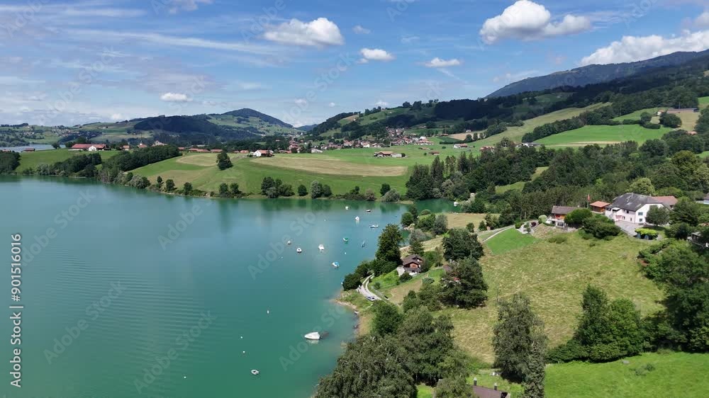Aerial drone view of the lakeside in the Gruyere region of Switzerland on a summer day Aerial drone view of the lakeside in the Gruyere region of Switzerland on a summer day