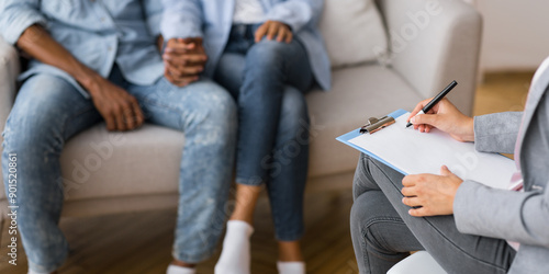 Bilde på lerret Unrecognizable man and woman holding hands during a psychotherapy session or adoption interview