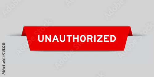 Red color inserted label with word unauthorized on gray background