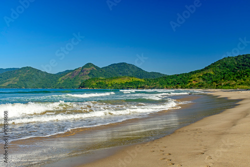 Panoramic image of Bonete beach in Ilhabela with the sea, hills and forests surrounding it