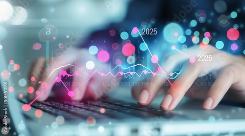 Hands Typing on Laptop With 2025 Data Visualization