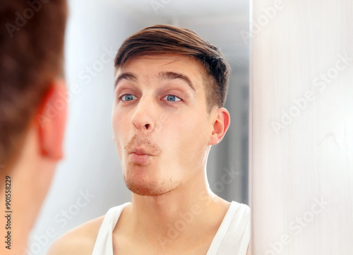 Young Man near a Mirror photo