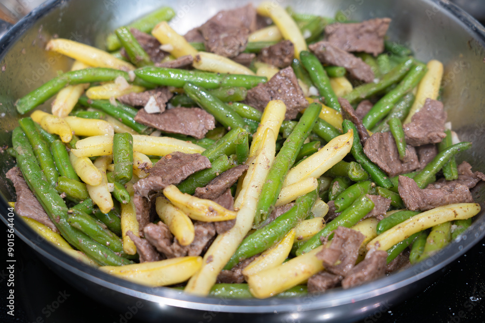 Stir Frying Beef with Green Yellow String Beans Closeup, Fried French Beans Mix with Meat, Asian Food Stir Frying Beef with Green Yellow String Beans Closeup, Fried French Beans Mix with Meat, Asian Food