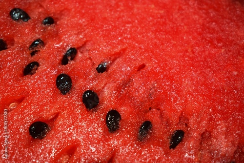 Summer refreshing background - juicy ripe watermelon with seeds close-up