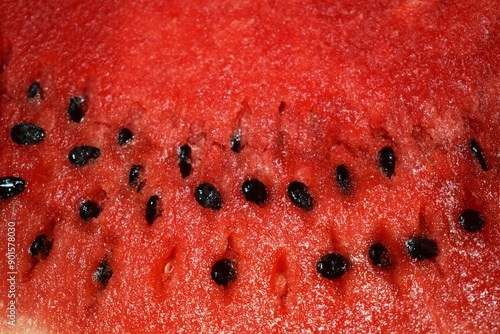 Summer refreshing background - juicy ripe watermelon with seeds close-up