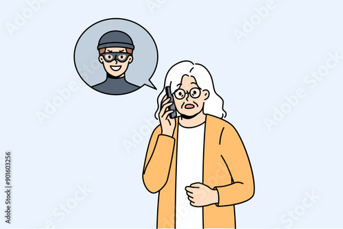 Elderly woman talking to telephone scammer who is trying to find out bank account password. Telephone scammer calls grandma, intimidating and forcing to provide personal information or using blackmail