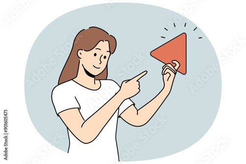 Woman holding play button suggesting start video or music from playlist and use multimedia technology. Girl points finger at large play sign designed to control media player or online cinema