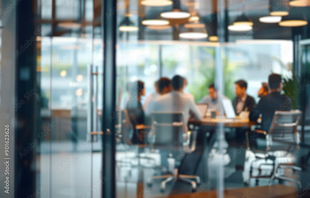 Blurred diverse group of businesspeople collaborating, smiling, and discussing work over laptops in a modern office setting.
Blurred diverse group of businesspeople collaborating, smiling, and discussing work over laptops in a modern office setting.