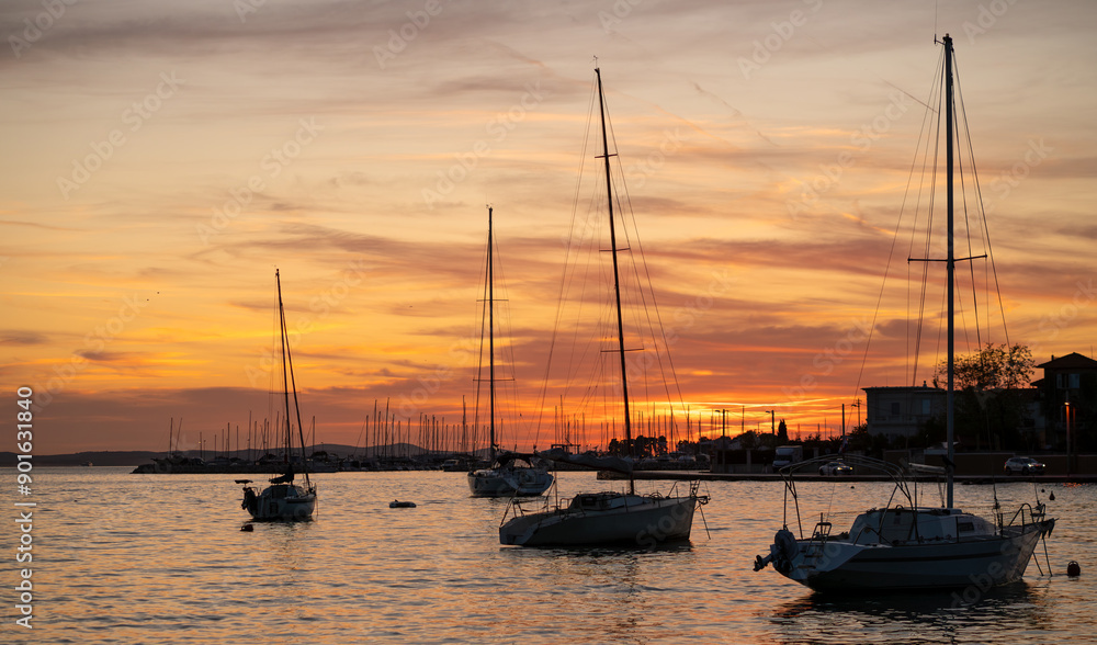 sailboats docked in the marina at beautiful sunset in Zadar, Croatia sailboats docked in the marina at beautiful sunset in Zadar, Croatia