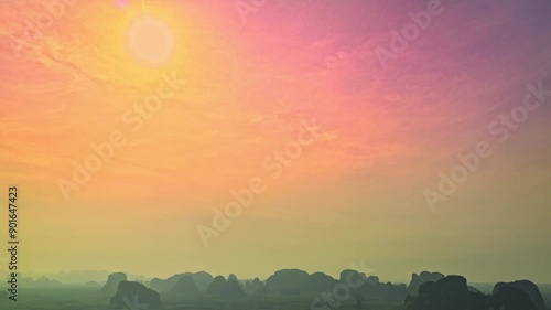 aerial hyper lapse view the moving clouds obscured the setting sun. 
the sun moving down to the islands at Tubkaek beach Krabi. 
Nature High quality footage in nature and travel concept. photo