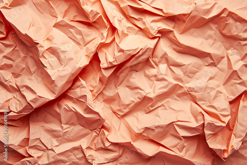 Texture of crumpled peach fuzz color paper. Sheet of crumpled paper for background, wallpaper and texture. Crumpled white paper abstract shape background with space paper for text photo