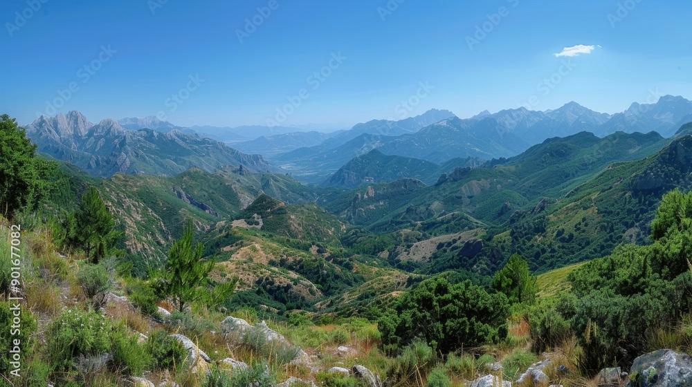 Naklejka premium Panoramic view of majestic mountains under a clear sky. Breathtaking natural landscape.