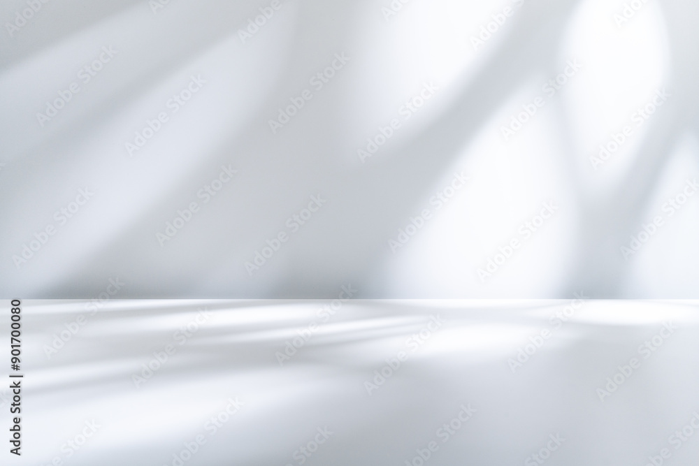 Abstract light background for product presentation. Shadow and light from window on smooth wall. Abstract light background for product presentation. Shadow and light from window on smooth wall.