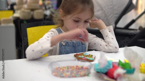 Engaging in Creative Cookie Decoration Fun with an Array of Colorful and Joyful Sprinkles