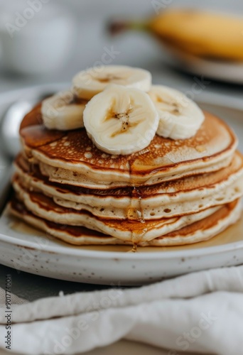 Banana Pancakes With Syrup and Powdered Sugar