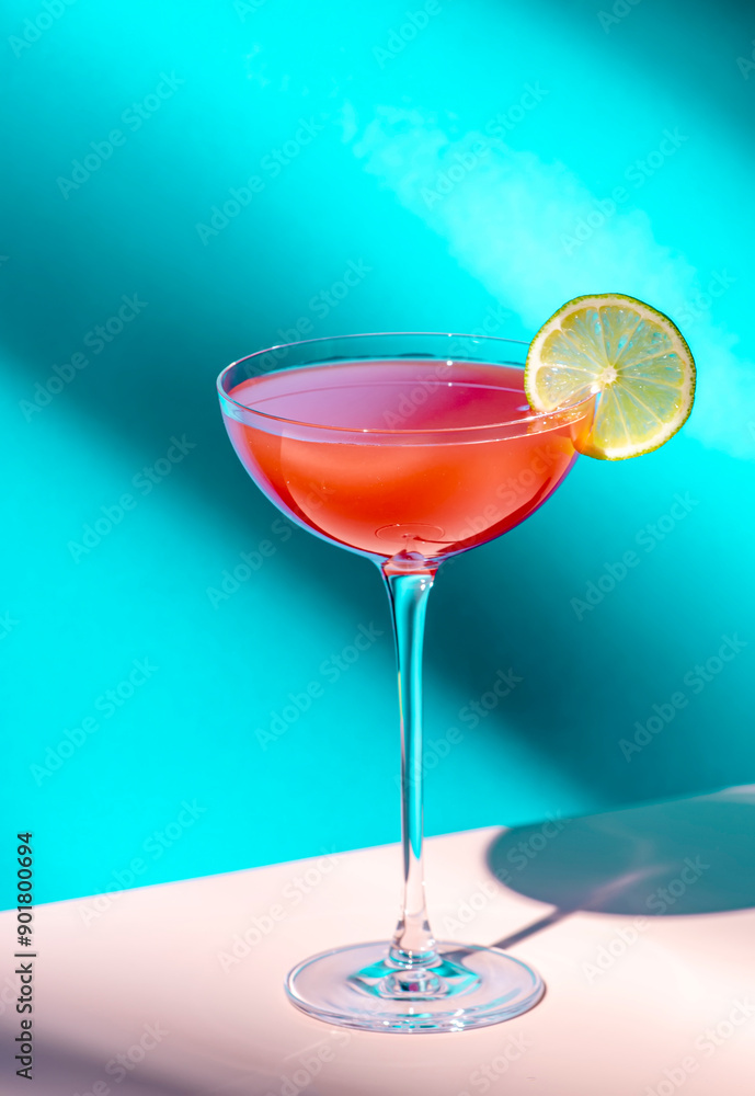 Summer red cocktail drink with tequila, grapefruit and lime juice, syrup, bitter, liqueur. Hard light and shadows Summer red cocktail drink with tequila, grapefruit and lime juice, syrup, bitter, liqueur. Hard light and shadows