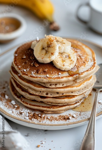 Banana Topped Pancakes on a Plate