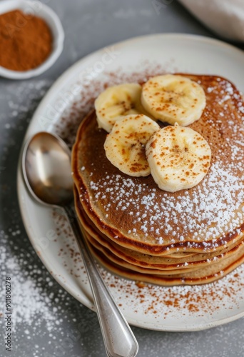 Banana Pancakes With Syrup and Powdered Sugar