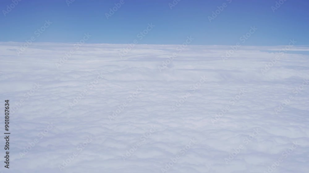 Wing of an airplane jet flying above clouds with blue sky from the window in traveling and transportation concept. Nature landscape background. Wing of an airplane jet flying above clouds with blue sky from the window in traveling and transportation concept. Nature landscape background.