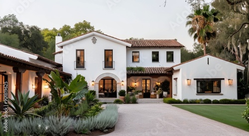 White Spanish Style Home With Lush Landscaping