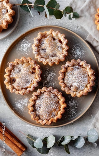 Four Mini Pies With Powdered Sugar