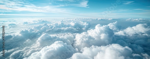 Highaltitude view of scattered clouds over a clear blue sky, sky scenery, peaceful atmosphere photo