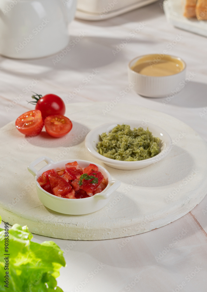 Vegetable sauces of different colors in bowls on a light background Vegetable sauces of different colors in bowls on a light background