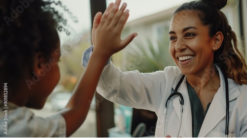 Smiling female doctor give high five to little biracial patient