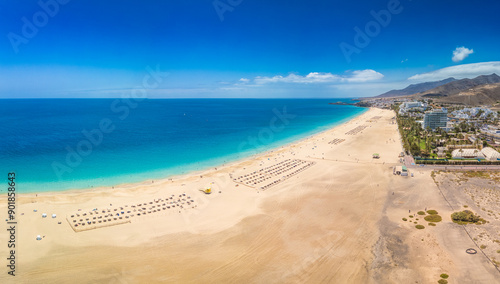 White sandy beach and blue water in Morro Jable, south of Fuerteventura, Canary islands photo