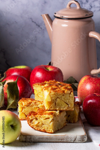 Obraz na płótnie Apple pie, apples and teapot served for tea. Traditional apple dessert. w salonie