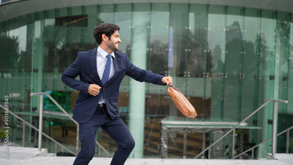 Successful business man celebrate for getting promotion while walking to office. Caucasian receive good news about sales increase or successful project. Manager feel overjoy and happy. Exultant. Successful business man celebrate for getting promotion while walking to office. Caucasian receive good news about sales increase or successful project. Manager feel overjoy and happy. Exultant.